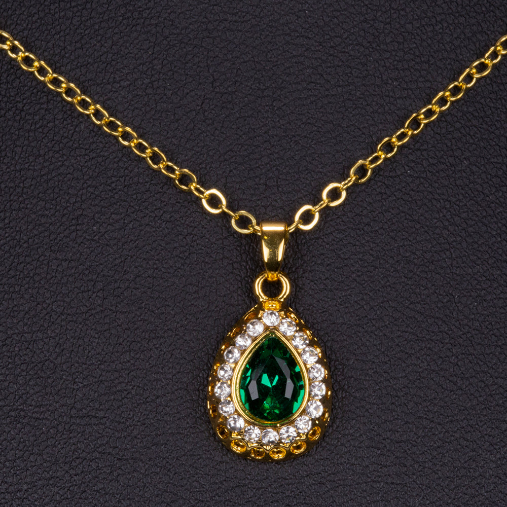 Schmuckgarnitur aus aus goldplattierter Legierung mit grünem Emporia® Kristall und weißem Emporia® Kristall