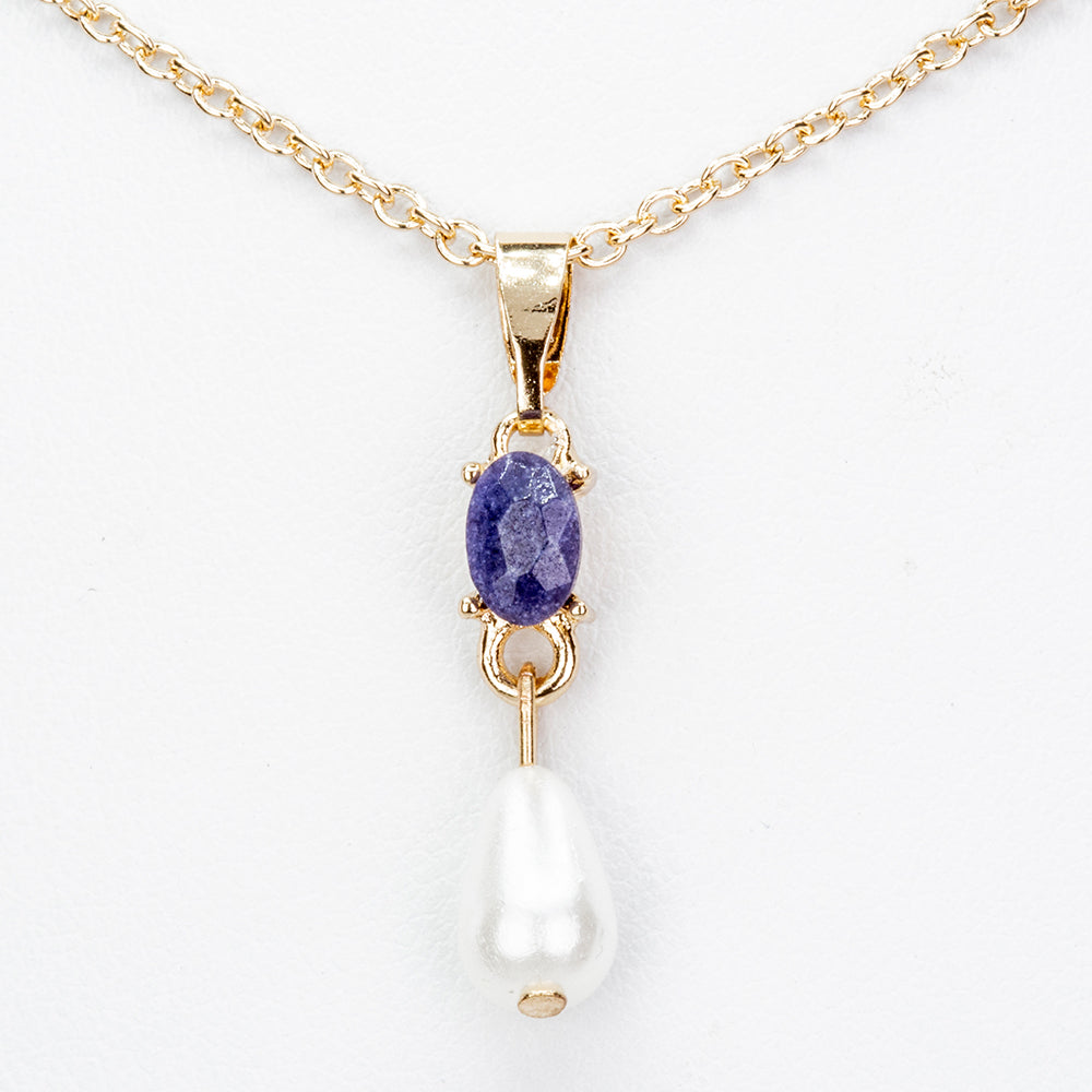 Schmuckgarnitur aus aus goldplattierter Legierung mit Saphir und Glasperle