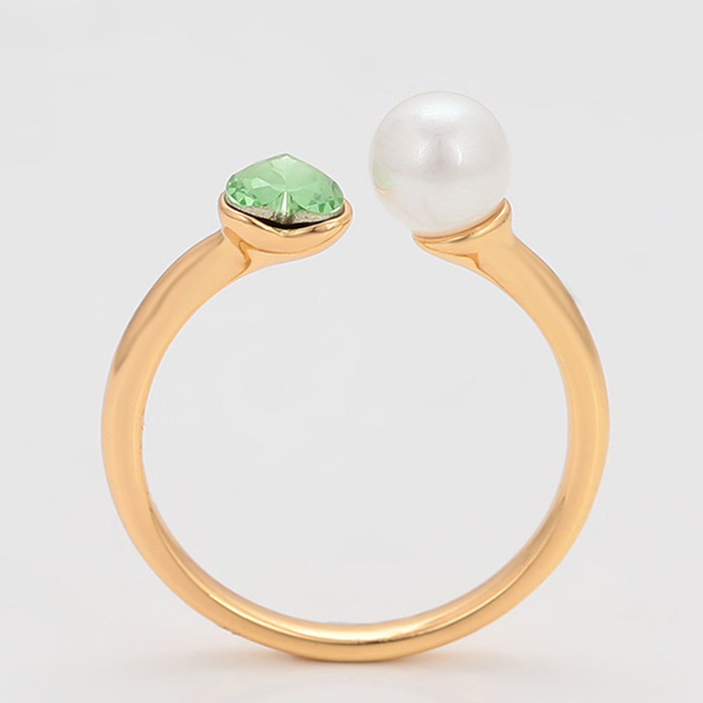 Ring aus goldplattierterr Legierung mit Glasperle und grünem Emporia® Kristall