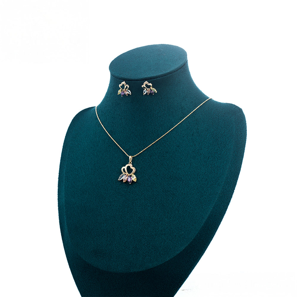 Schmuckgarnitur aus aus goldplattierter Legierung mit purpurfarbenem Emporia® Kristall und weißem Emporia® Kristall