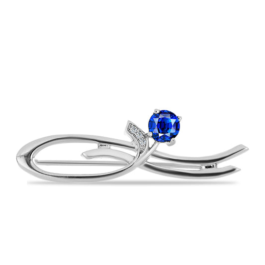 Silberbrosche mit australischem blauem Saphir und weißem Topas