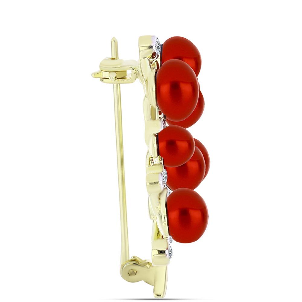 Goldplattierte Silberbrosche mit roter Süßwasserperle und weißem Topas