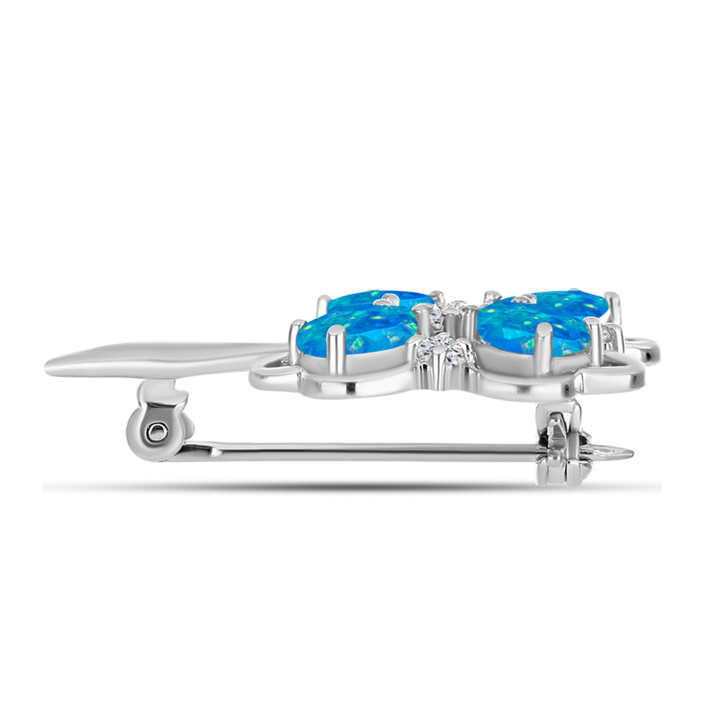 Silberbrosche mit äthiopischem Paraiba-Blauopal und weißem Topas
