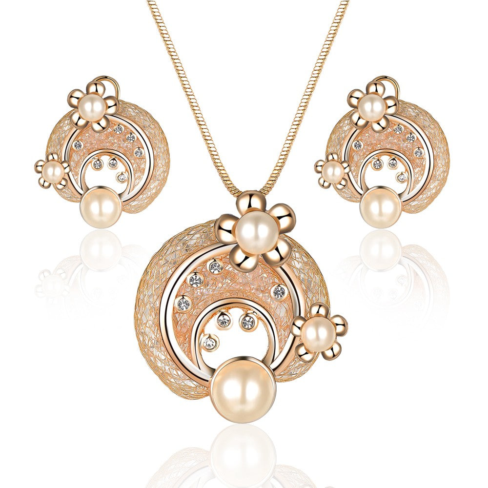 Schmuckgarnitur aus aus goldplattierter Legierung mit weißem Emporia® Kristall