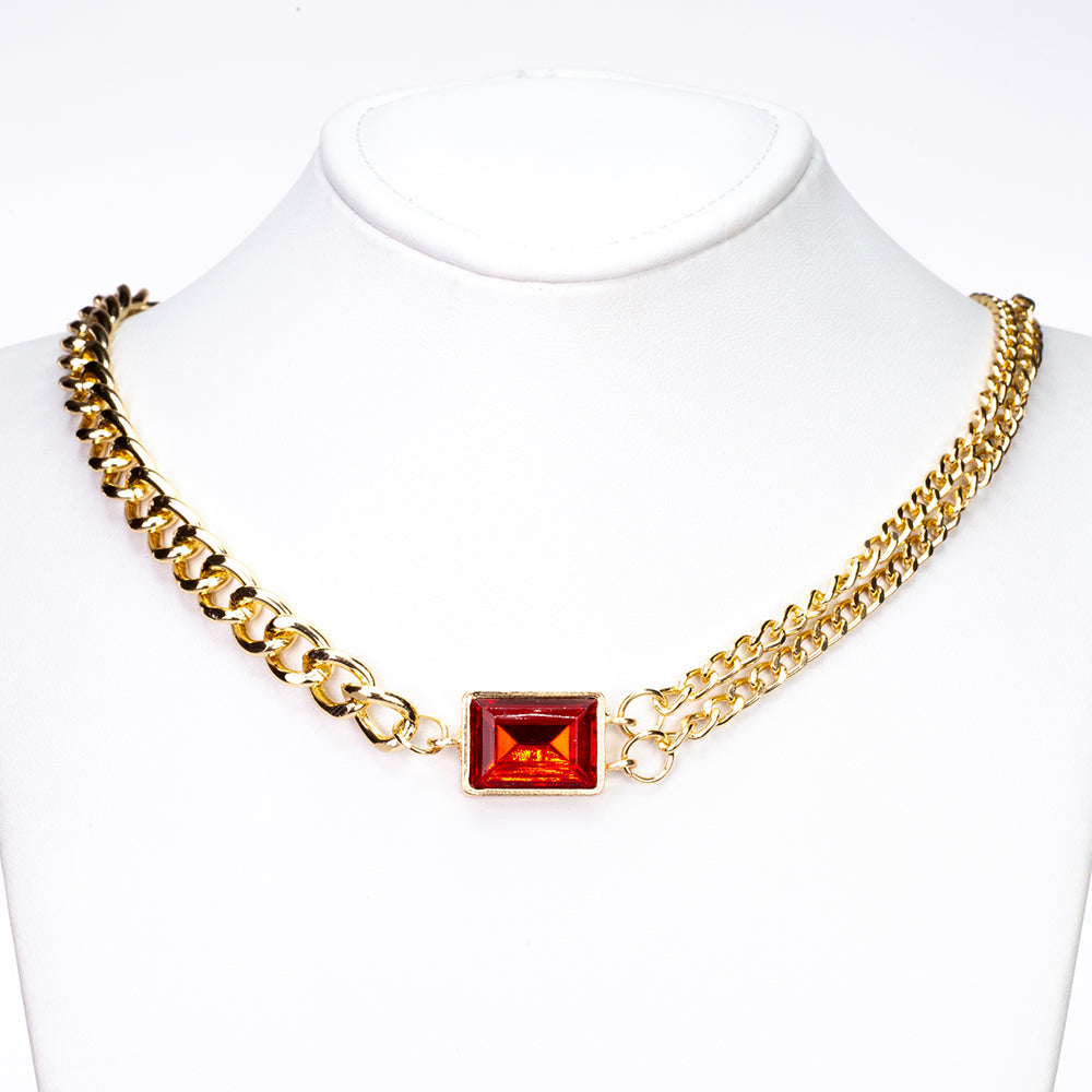 Uhr aus goldplattierter Legierung mit rotem Emporia®-Kristall