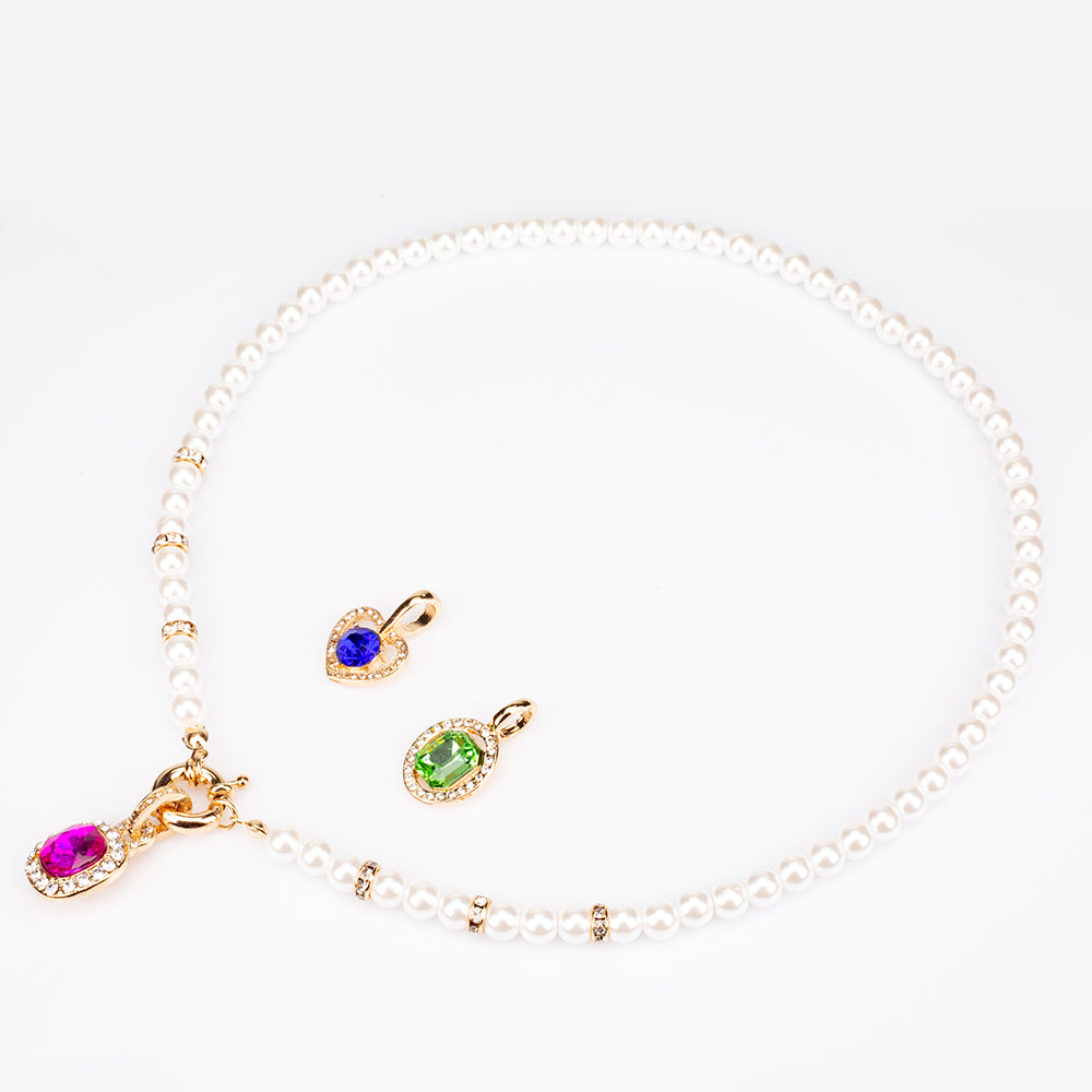 Schmuckgarnitur aus aus goldplattierter Legierung mit rotem Emporia®-Kristall und blauem Emporia®-Kristall