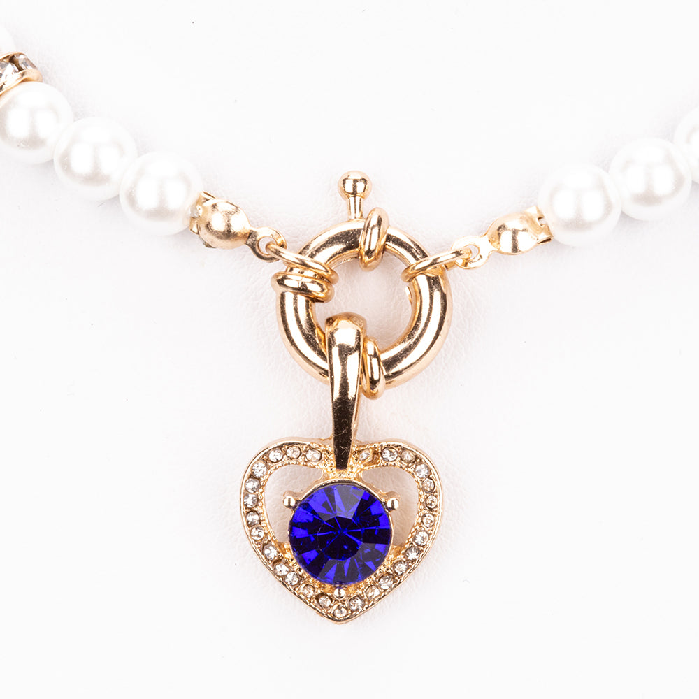 Schmuckgarnitur aus aus goldplattierter Legierung mit rotem Emporia®-Kristall und blauem Emporia®-Kristall