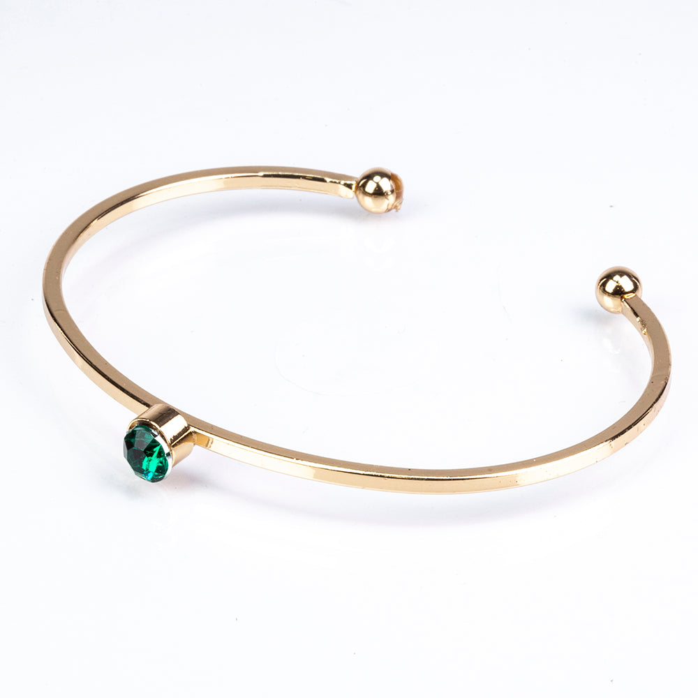 Schmuckgarnitur aus aus goldplattierter Legierung mit Emaille und grünem Emporia® Kristall