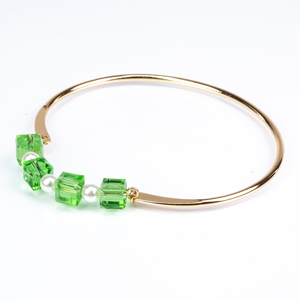 Schmuckgarnitur aus aus goldplattierter Legierung mit Emaille und grünem Emporia® Kristall
