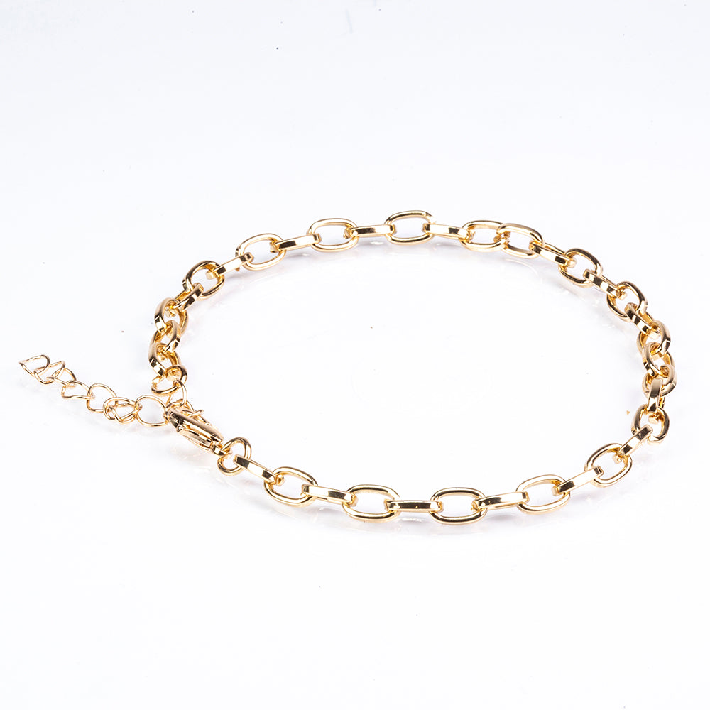 Schmuckgarnitur aus aus goldplattierter Legierung mit Emaille und grünem Emporia® Kristall