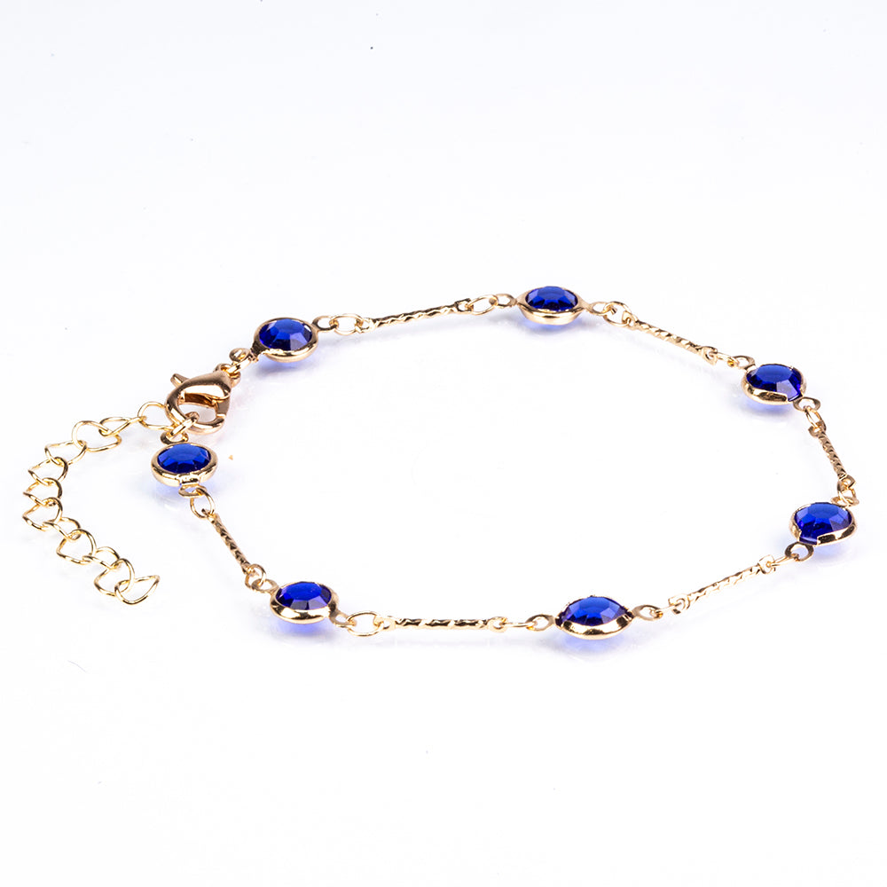 Schmuckgarnitur aus aus goldplattierter Legierung mit blauem Emporia®-Kristall