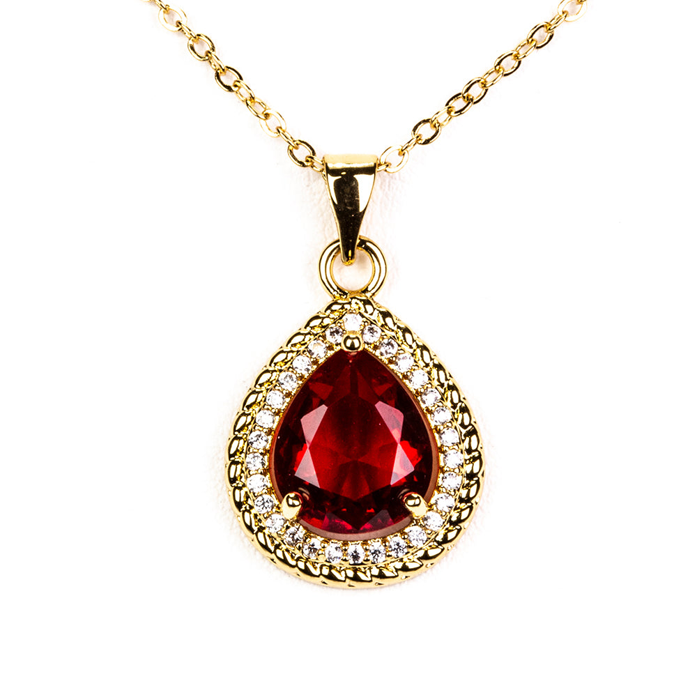 Schmuckgarnitur aus aus goldplattierter Legierung mit rotem Emporia®-Kristall