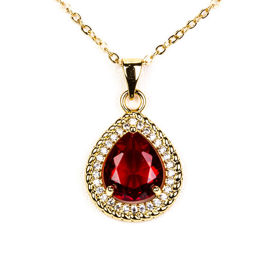 Schmuckgarnitur aus aus goldplattierter Legierung mit rotem Emporia®-Kristall