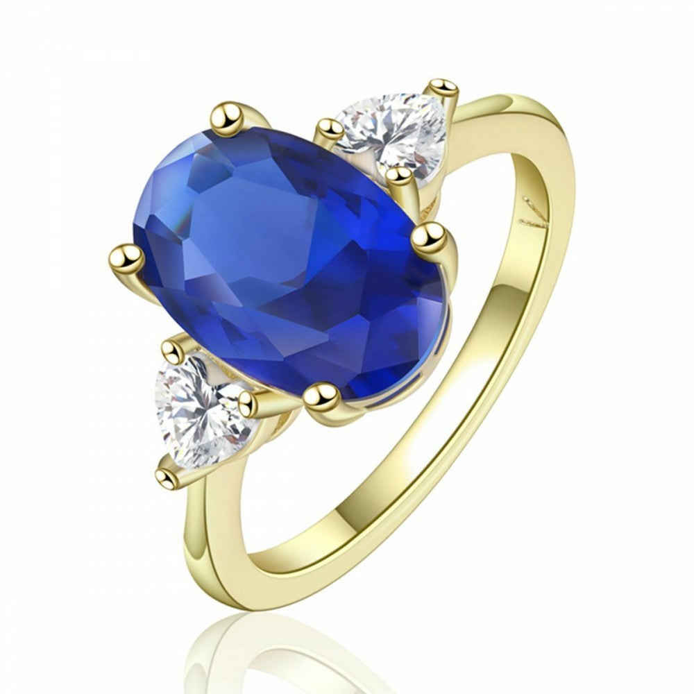 Ring aus goldplattierterr Legierung mit blauem Emporia®-Kristall