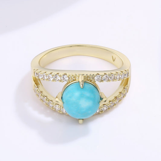 Ring aus goldplattierter Legierung mit blauem Emporia®-Kristall