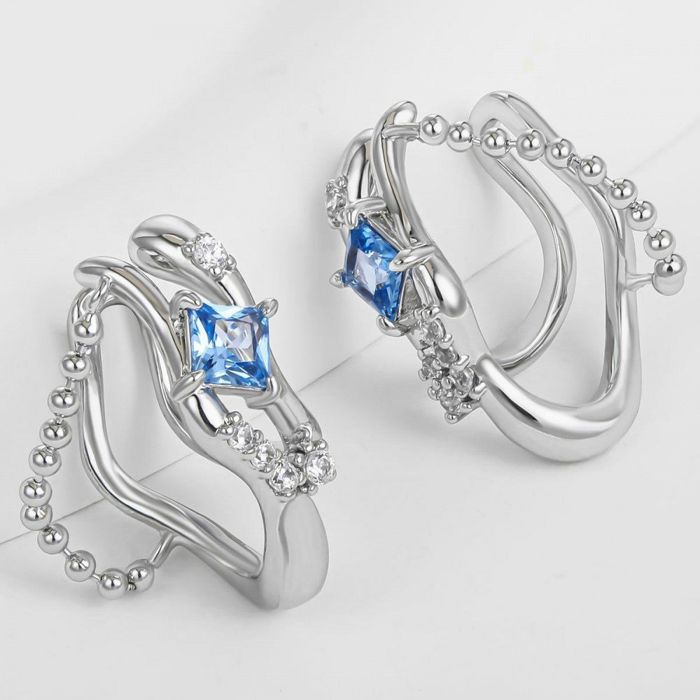 Ohrringe aus goldplattierter Legierung mit blauem Emporia®-Kristall 1 