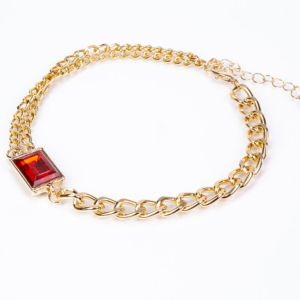 Uhr aus goldplattierter Legierung mit rotem Emporia®-Kristall und weißem Emporia® Kristall