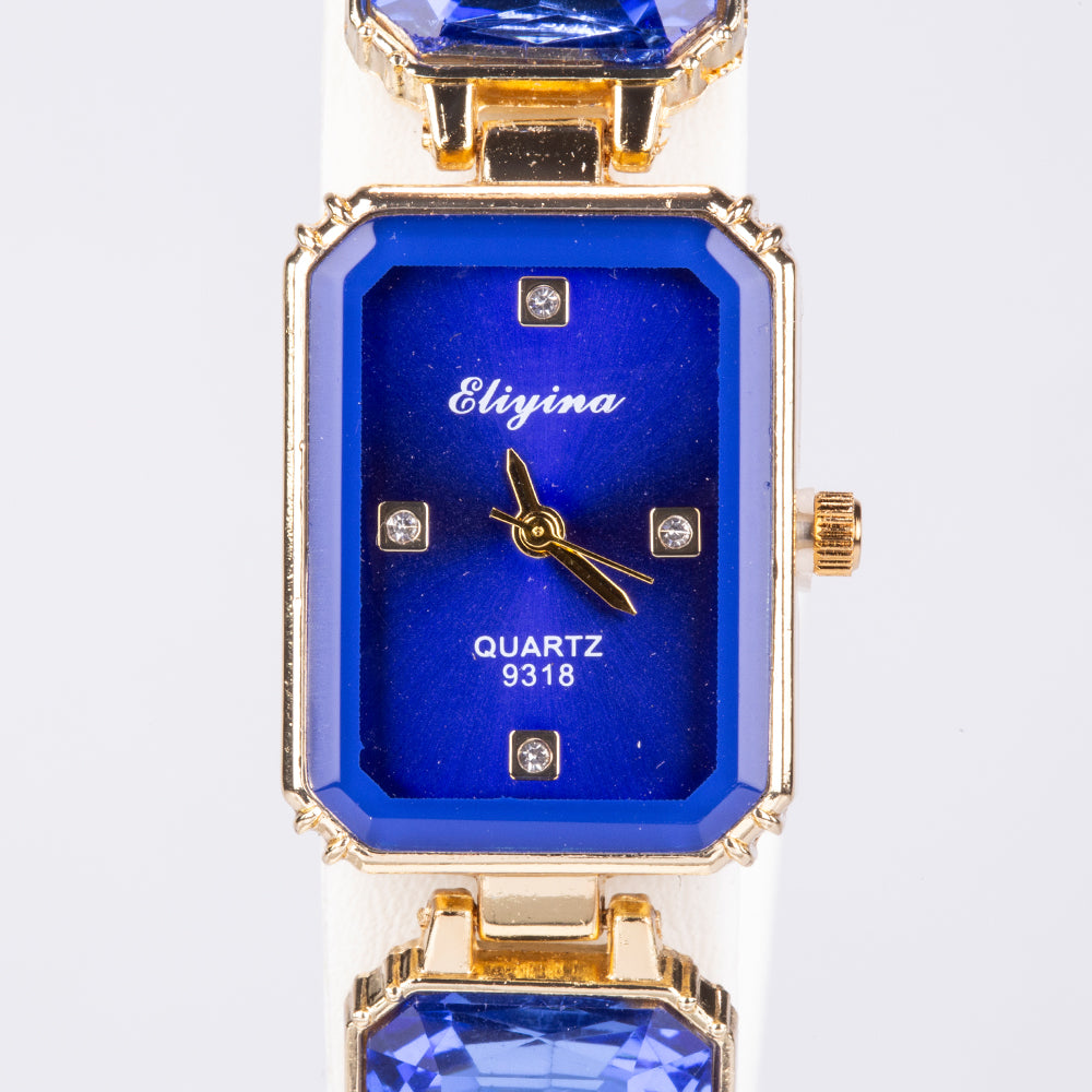 Uhr aus goldplattierter Legierung mit blauem Emporia®-Kristall