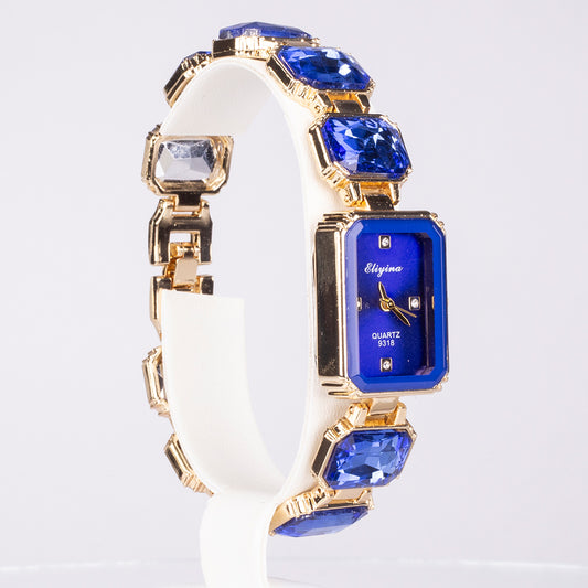 Uhr aus goldplattierter Legierung mit blauem Emporia®-Kristall