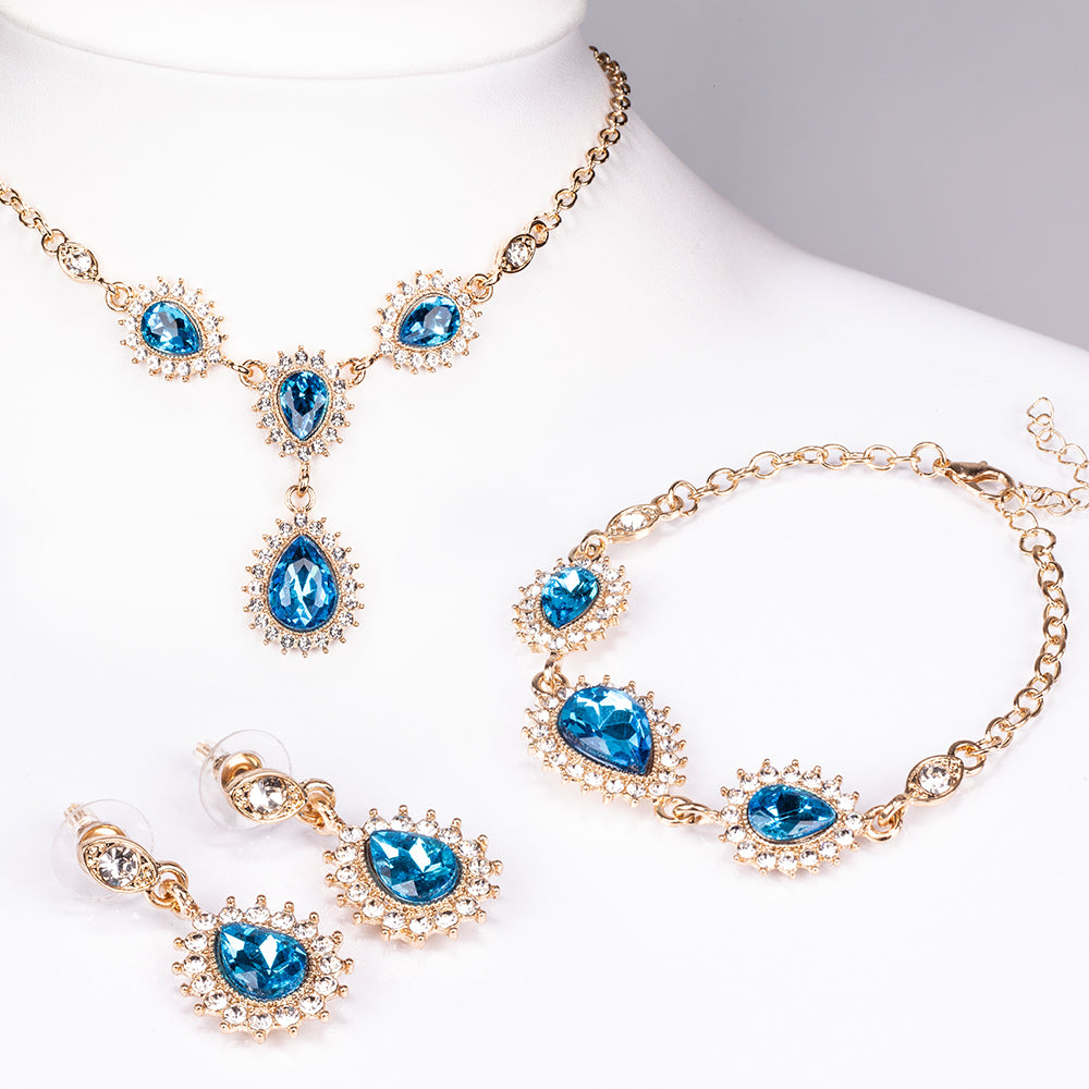 Schmuckgarnitur aus aus goldplattierter Legierung mit blauem Emporia®-Kristall und weißem Emporia® Kristall