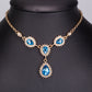 Schmuckgarnitur aus aus goldplattierter Legierung mit blauem Emporia®-Kristall und weißem Emporia® Kristall