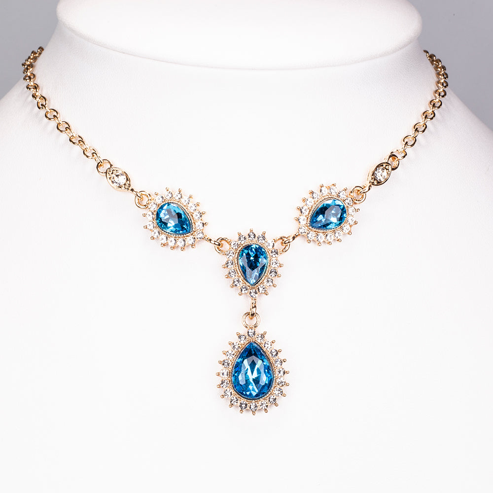 Schmuckgarnitur aus aus goldplattierter Legierung mit blauem Emporia®-Kristall und weißem Emporia® Kristall