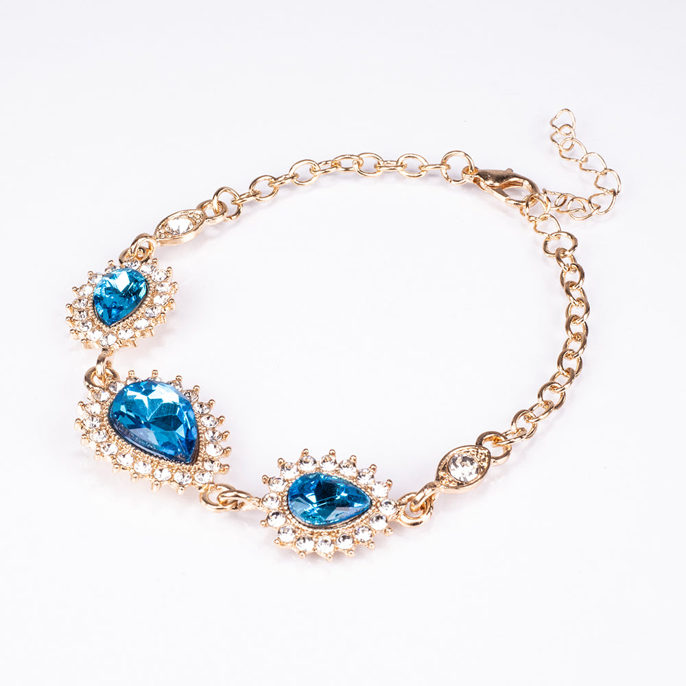 Schmuckgarnitur aus aus goldplattierter Legierung mit blauem Emporia®-Kristall und weißem Emporia® Kristall