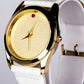 Uhr aus goldplattierter Legierung mit Rubin