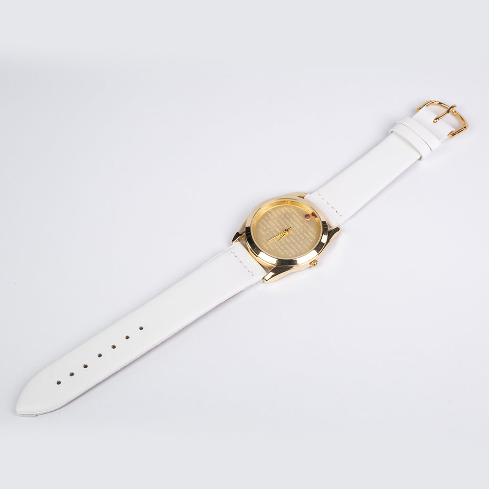 Uhr aus goldplattierter Legierung mit Rubin