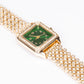 Uhr aus goldplattierter Legierung mit grünem Emporia® Kristall und weißem Emporia® Kristall