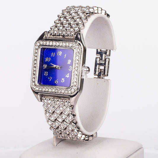 Uhr aus goldplattierter Legierung mit blauem Emporia®-Kristall und weißem Emporia® Kristall