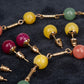 Schmuckgarnitur aus aus goldplattierter Legierung mit Amethyst und Jade