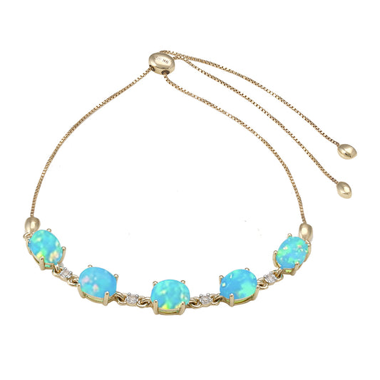 Goldarmband mit äthiopischem Paraiba-Blauopal und weißem Topas