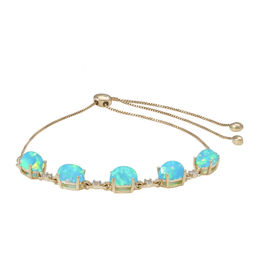 Goldarmband mit äthiopischem Paraiba-Blauopal und weißem Topas