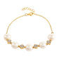 Goldplattiertes Silberarmband mit barocker Süßwasserzuchtperle und weißem Topas