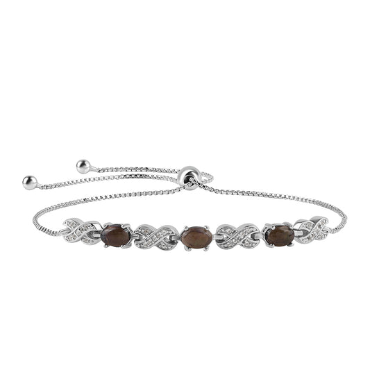 Silberarmband mit mitternachtsschwarzem äthiopischen Opal aus Lega Dembi und weißem Topas