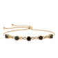 Goldplattiertes Silberarmband mit schwarzem Spinell und weißem Topas