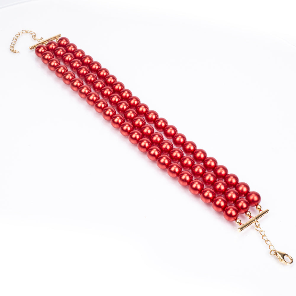 Goldplattiertes Silberarmband mit roter Süßwasserperle