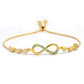 Goldplattiertes Silberarmband mit brasilianischem Smaragd und weißem Topas