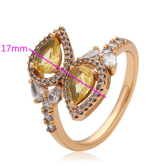 Ring aus goldplattierterr Legierung mit gelbem Emporia®-Kristall und weißem Emporia® Kristall