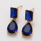 Ohrringe aus goldplattierter Legierung mit blauem Emporia®-Kristall