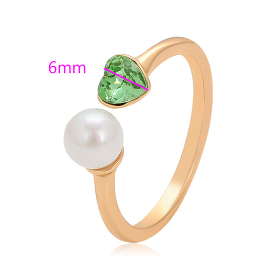 Ring aus goldplattierterr Legierung mit Glasperle und grünem Emporia® Kristall