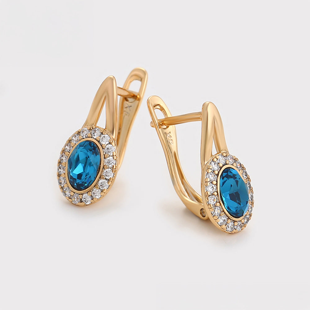 Ohrringe aus goldplattierter Legierung mit blauem Emporia®-Kristall und weißem Emporia® Kristall