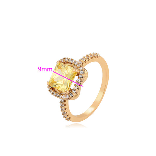 Ring aus goldplattierterr Legierung mit gelbem Emporia®-Kristall und weißem Emporia® Kristall