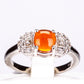 Silberring mit orangefarbenem Opal aus Lega Dembi und weißem Topas