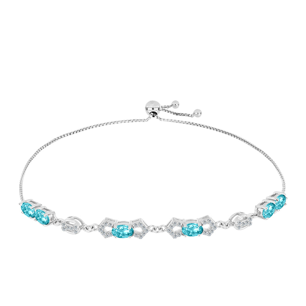 Silberarmband mit Paraiba Quarz und weißem Topas