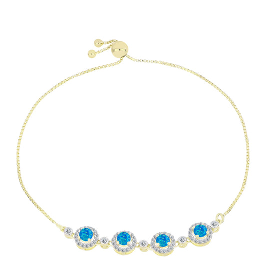 Goldplattiertes Silberarmband mit äthiopischem Paraiba-Blauopal und weißem Topas