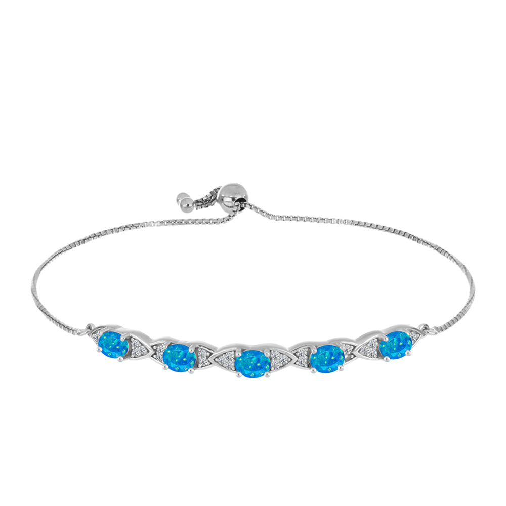 Silberarmband mit äthiopischem Paraiba-Blauopal und weißem Topas