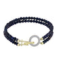 Goldplattiertes Silberarmband mit schwarzer Süßwasserzuchtperle und weißem Topas