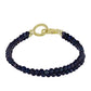 Goldplattiertes Silberarmband mit schwarzer Süßwasserzuchtperle und weißem Topas